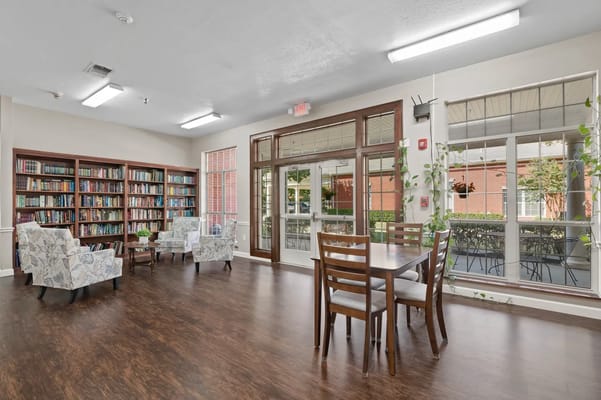 Bright common area with bookshelves and seating