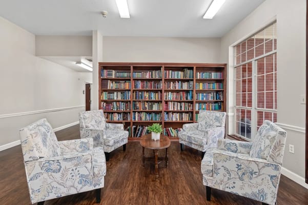 Cozy lounge area with bookshelves and seating
