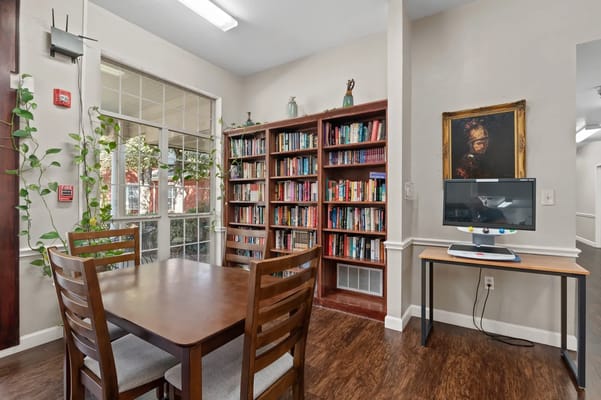 Interior common area with bookshelves and tables