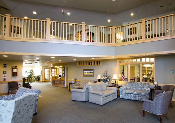 Bright and spacious lobby area with seating at The Lexington Assisted Living