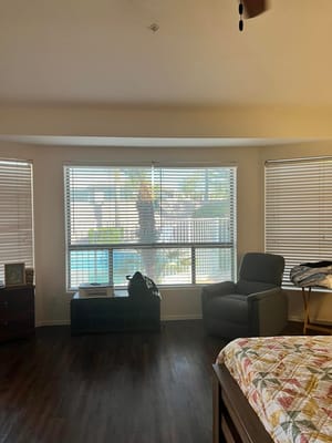 Bright resident room with a view of the pool