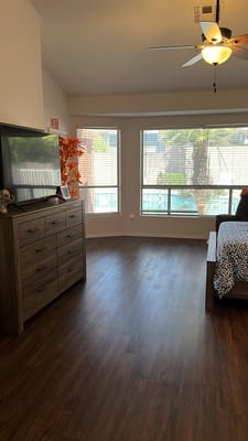 Bright interior of a resident room with large windows