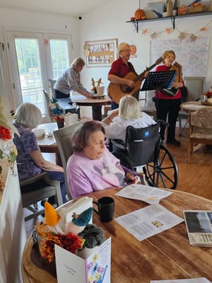 Residents enjoying live music in a common area