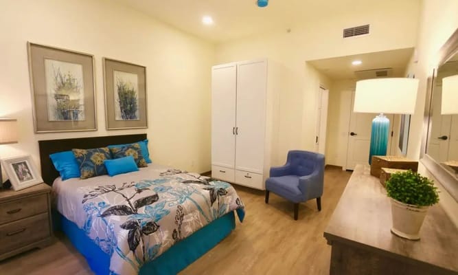 A well-decorated resident bedroom with floral bedding