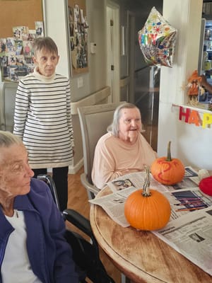 Residents celebrating Halloween with pumpkins