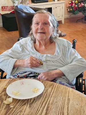 A resident enjoying a snack in the common area