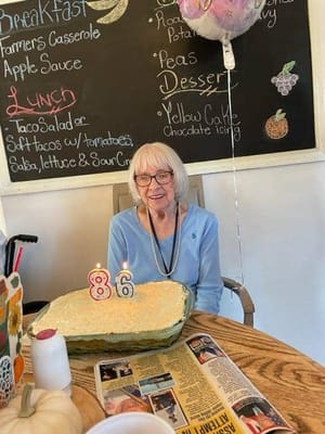 Resident celebrating 86th birthday with cake