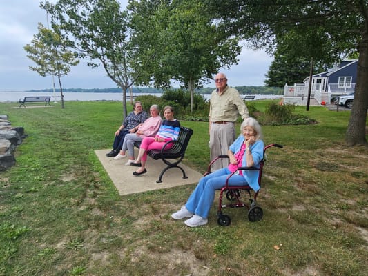 Residents enjoying a scenic outdoor area by the water