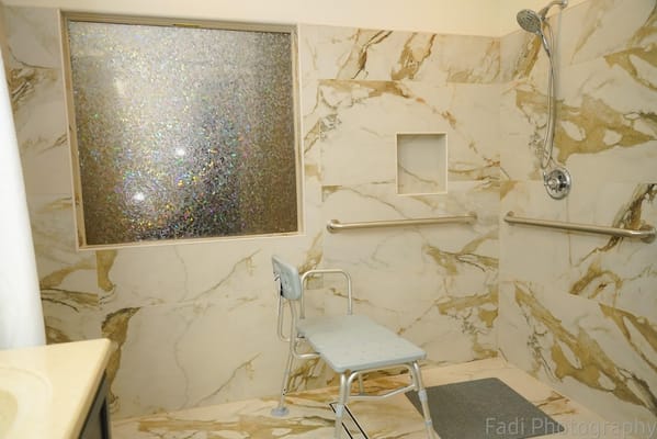 Spacious bathroom with a shower and safety features