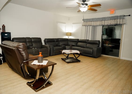 Cozy living room with leather sofas and coffee tables