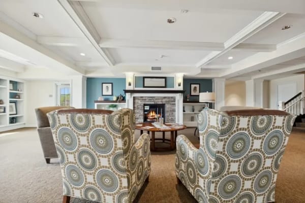 Comfortable lounge area with chairs and fireplace