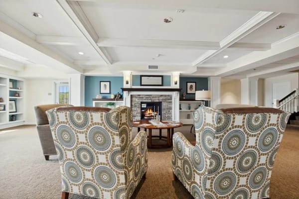 Comfortable lounge area with chairs and fireplace