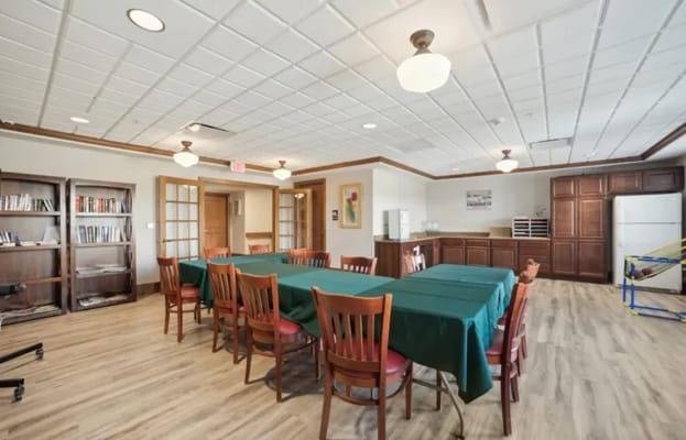 Interior view of a dining room with tables and chairs