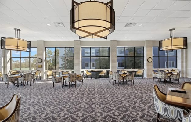 Bright dining room with large windows and modern decor