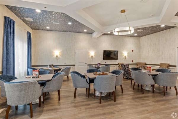 Bright common area with seating and games