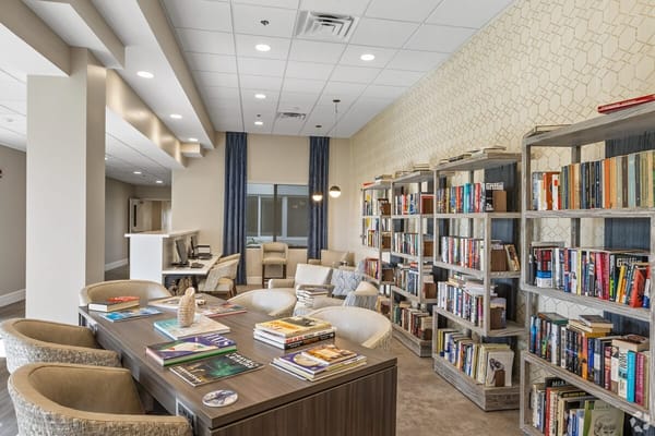 Cozy interior common area with bookshelves and seating