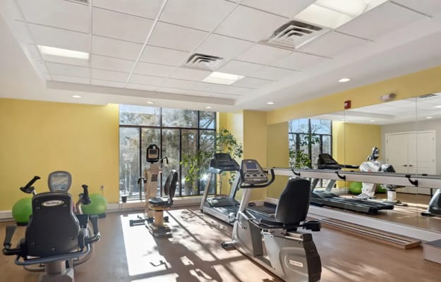 Interior view of a fitness center with exercise equipment