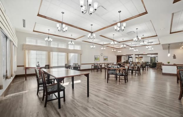 Bright dining area with tables and chairs