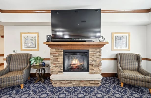 Cozy interior living space with fireplace and seating