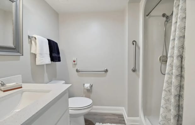 Clean private bathroom with modern fixtures