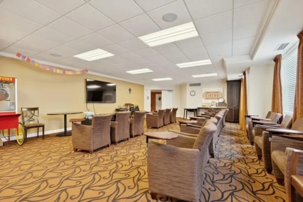 Bright activity room with seating and television