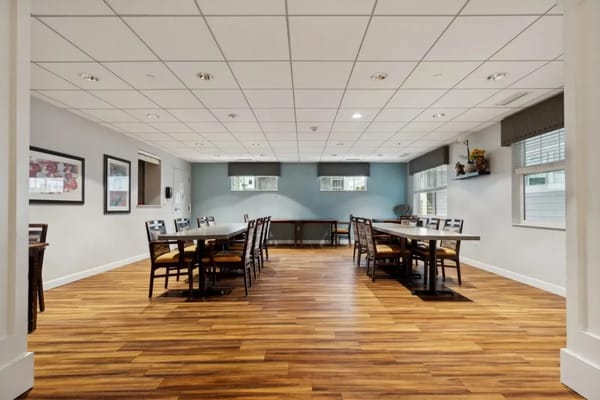 Spacious common area with tables and chairs