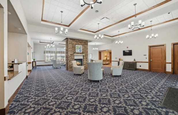 Interior common area with seating and a fireplace