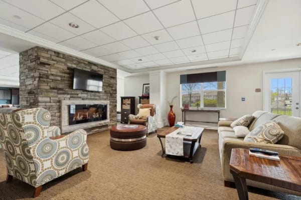 Cozy common area with seating and a fireplace