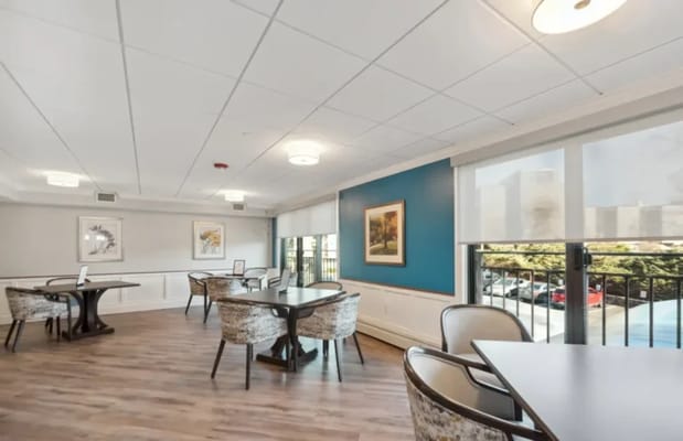 Bright common area with tables and chairs