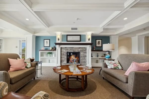 Cozy common area with seating and a fireplace