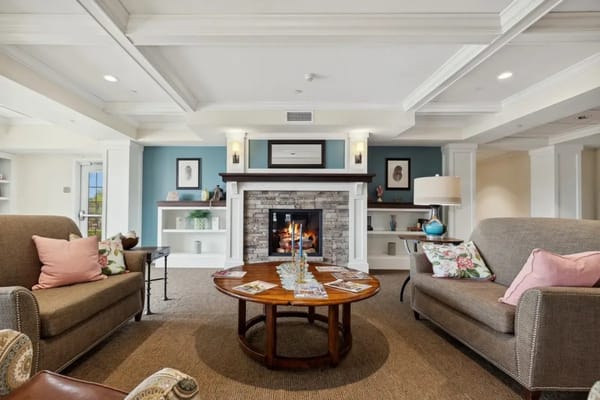 Cozy common area with seating and a fireplace