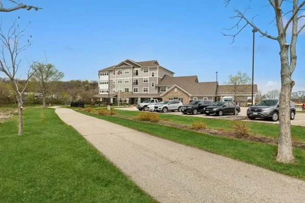 A view of the assisted living facility's exterior and parking area