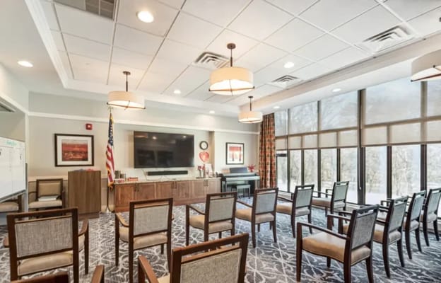 Interior common area with seating and a TV