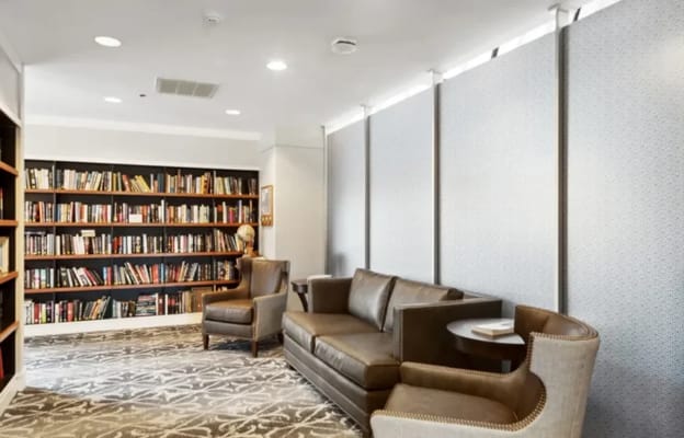 Cozy reading area with bookshelves and seating