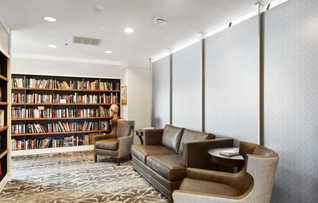 Cozy reading area with bookshelves and seating