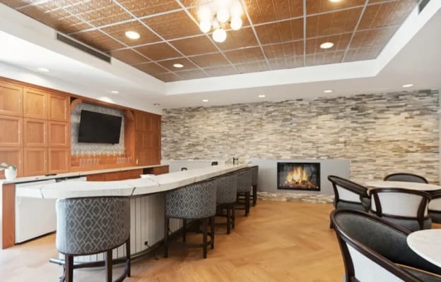 Interior lounge with seating and a fireplace