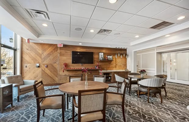 Bright common area with tables and chairs