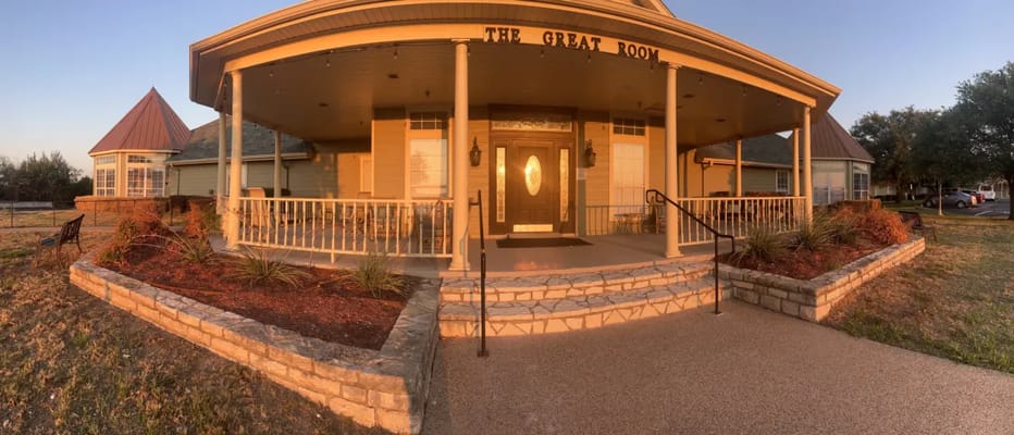 Exterior view of a building entrance with porch