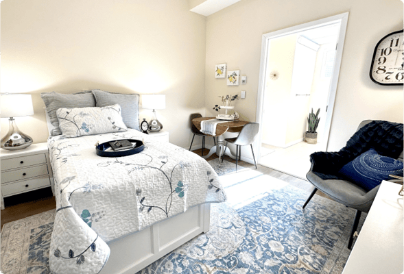 Bright and cozy resident bedroom with furnishings