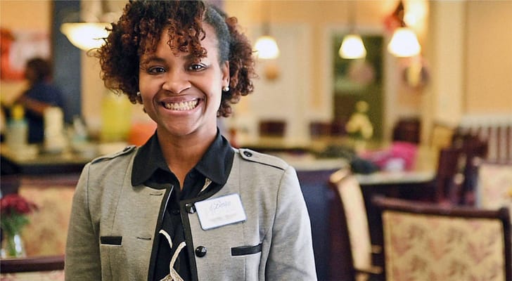 Staff member smiling in a common area