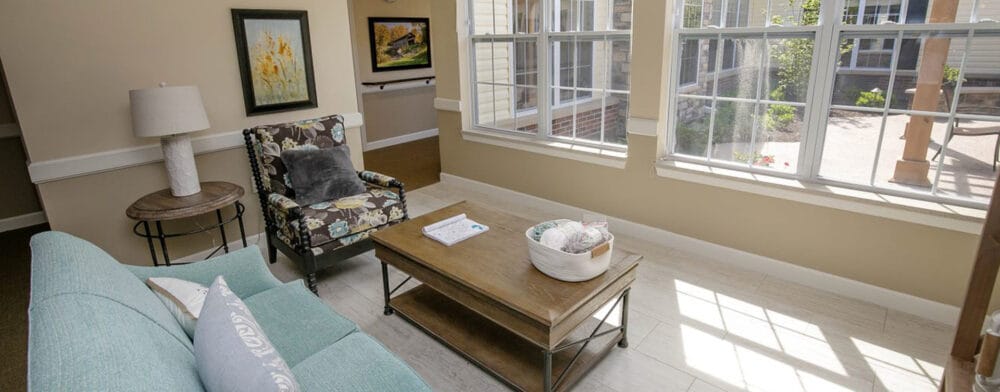 Bright common area with comfortable seating and natural light