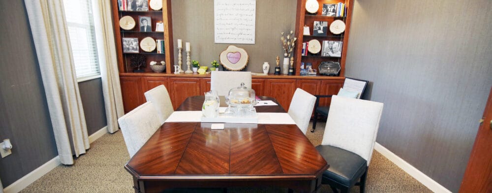 Cozy dining area with a large table and decorative shelves