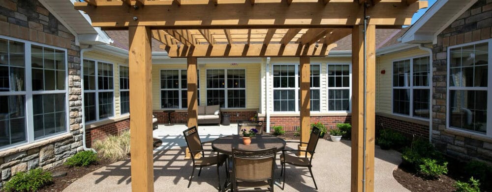 Outdoor courtyard with seating and pergola