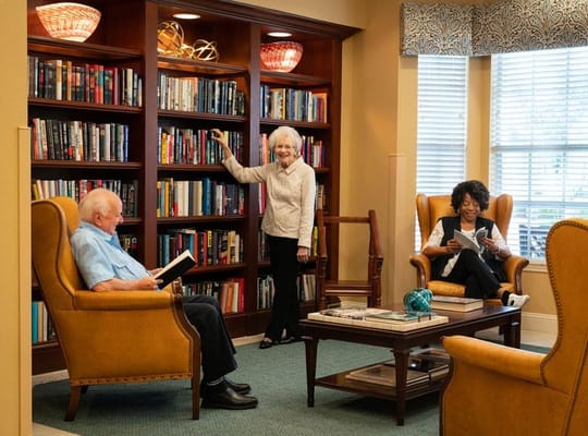 Residents enjoying books in a cozy reading area