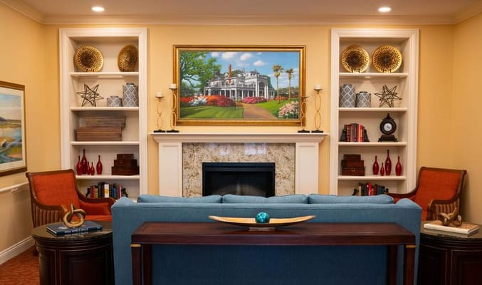 Cozy common area with a fireplace and artwork