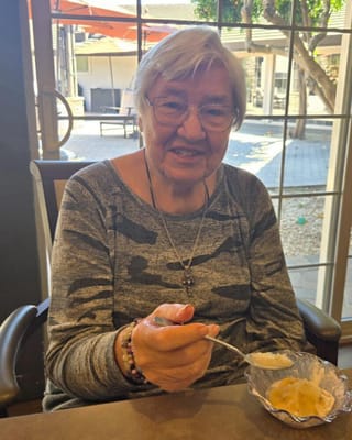 Resident enjoying dessert in a common area