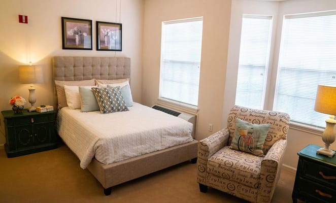 Cozy resident room with natural light and furniture