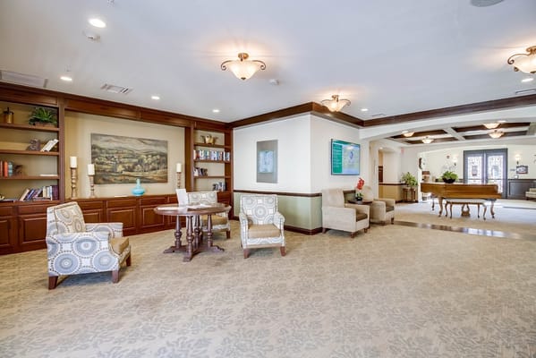 Comfortable common area with seating and bookshelves