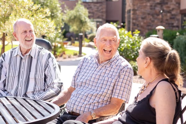 Residents enjoying conversation outdoors in the garden