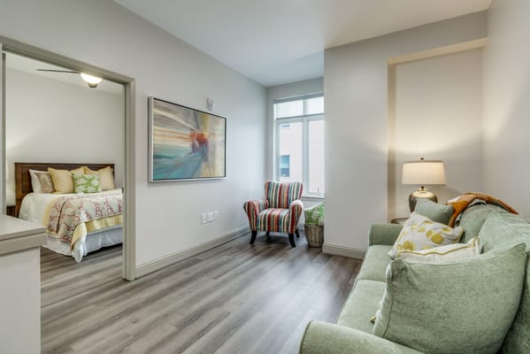 Bright interior of a resident room with seating area